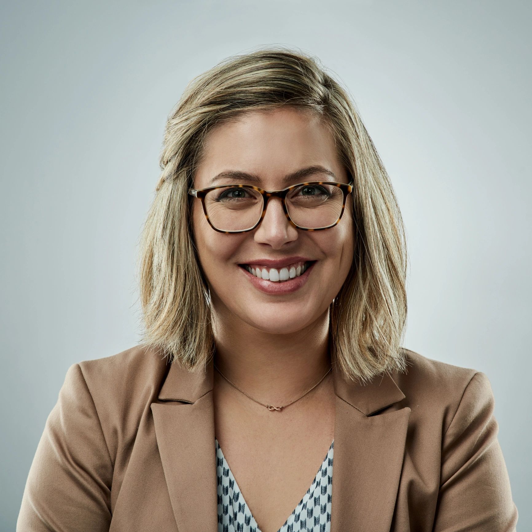 Professional headshot representing client coordination specialist